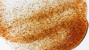 Close up image of a LATHER exfoliator product, emphasizing grainy texture that constitutes its exfoliating properties.