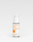 A clear plastic bottle with a white pump dispenser containing the Wrinkle Remedy Serum, with a label that includes the product name and the brand.