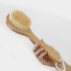 sisal brush in hand to show size