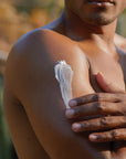 Male model using the Coconut Creme Body Whip