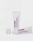 Two tubes of LATHER Lip Conditioning Balm against a white background.