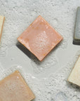 Variety of LATHER bar soaps in sudsy water