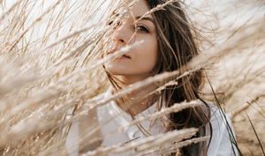 Woman in field of wheat