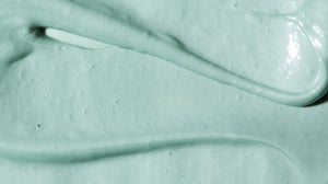 Close up image of body scrub product, emphasizing texture of product.