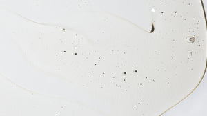Close up of LATHER cleanser product, emphasizing texture.
