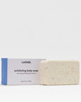 Bar of exfoliating body soap with packaging labeled 'LATHER' on a white background