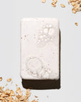 Bar of soap with oatmeal on a light background