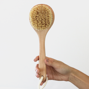 sisal brush in hand to show realistic size